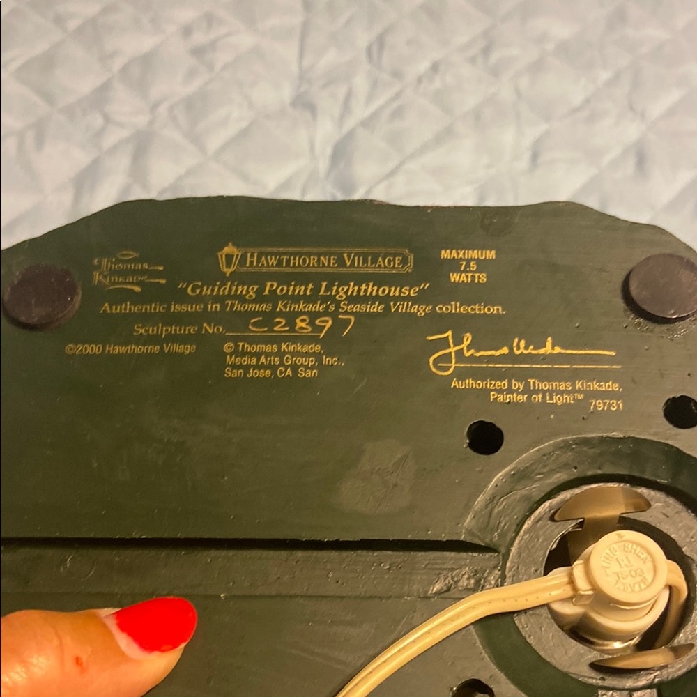 Green Metal Surface with Gold Lettering